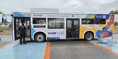 A-wrapped-bus-being-used-to-promote-Goverments-22Share-the-Care22-program-scaled.jpeg