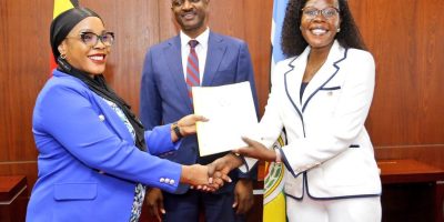 Anite-hands-over-investment-ministry-docket-to-Mukalazi-as-PSST-Ggobi-looks-on-recently.jpeg