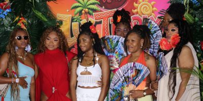 Attendees-pose-on-the-branded-red-carpet-upon-arrival-at-Soca-Wine_-Lux-Tropix-at-The-Concorde-Exper.jpeg