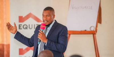 Brian-Ddamba-SME-Business-Development-Manager-addressing-School-owners-during-a-School-Bridge-Financ.jpeg