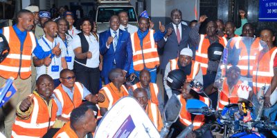Centenary-Bank-Executive-Director-Business-Michael-Opira-centre-at-the-launch-of-the-road-safety-cam.jpeg