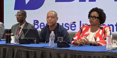 Central-Bank-Governor-Dr-Kevin-Greenidge-center-addresses-the-press-conference.-He-is-flanked-by-dep.jpeg