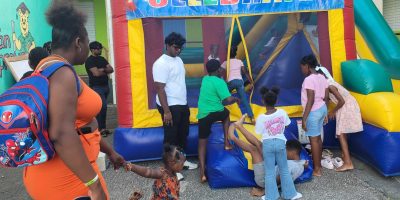 Children-from-communities-in-Christ-Church-enjoy-one-of-the-rides-at-the-Errol-Barrow-Fun-Day-on-Tuesday.-SM-scaled-e1737616120580.jpg