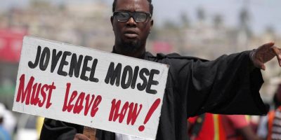 Jovenel-Moise-must-leave-now-demonstrator-Photo-R.-Blackwell-AP-scaled.jpg