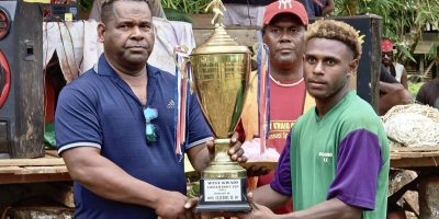 Member-of-Parliament-for-the-West-Kwaio-Constituency-Hon-Cloudio-Teifi-handed-over-the-wining-trophy-to-Suu-habour-player.jpg