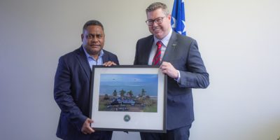 Minister-Pat-Conroy-MP-presents-a-framed-photograph-as-a-gift-to-Minister-Ramofafia.jpg