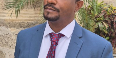 Minister-of-Housing-Lands-and-Maintenance-Chris-Gibbs-scaled.jpg