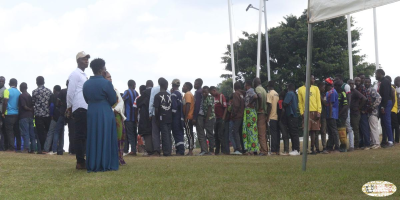 People-lining-up-for-lunch-at-Karuzika-Royal-palace.png