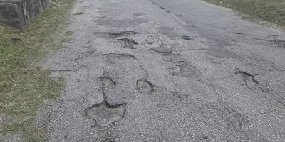 Potholes-along-Bannatyne-Road-Christ-Church-RR-scaled.jpg