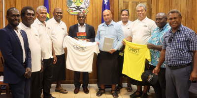 Prime-Minister-Hon.-Jeremiah-Manele-accepts-promotional-merchandise-.png