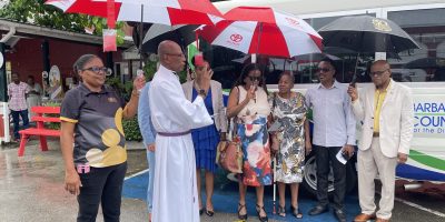 Reverend-Canon-Noel-Burke-blesses-the-new-bus-as-stakeholders-look-on-scaled.jpg