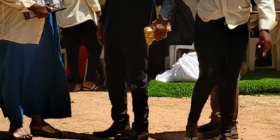 Rogers-holding-a-pussel-of-money-and-Zainab-pulling-his-hand-after-securing-it-from-her.jpg