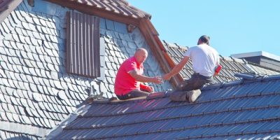 Roof-repairmen-fixing-a-damaged-roof.jpg