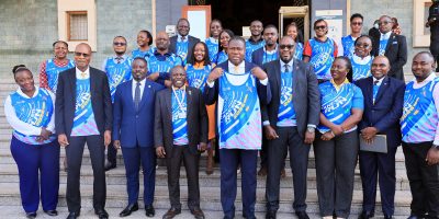 Speaker-Oboth-poses-with-for-a-photo-with-the-organisers-of-the-Cancer-run-at-the-step-sof-Parliamen.jpeg