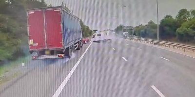 leaving-obliterated-across-motorway-hgv-1036682414.jpg