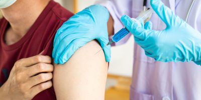 medium-vecteezy_person-receiving-a-vaccine_1986908_medium.jpg