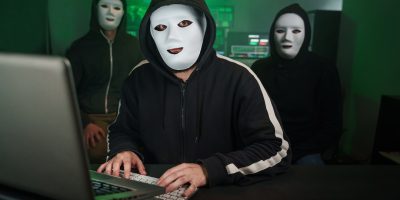 team-of-masked-hackers-using-computer-to-inflict-d-2023-11-27-05-05-16-utc-1.jpg